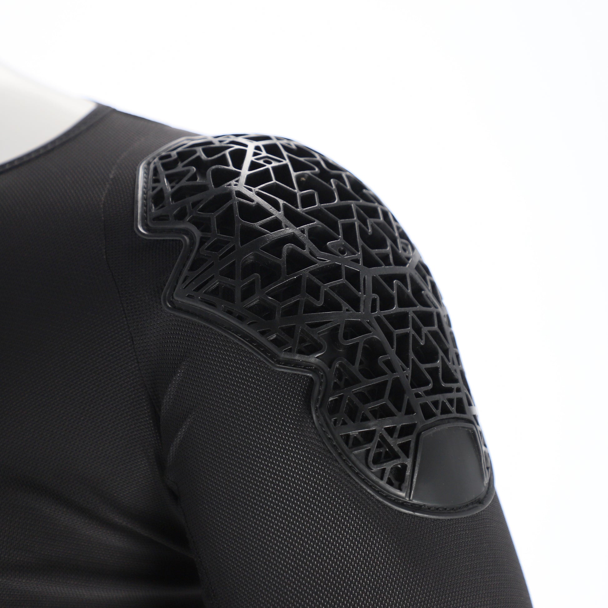 Black protective shoulder pad with geometric pattern on a white background
