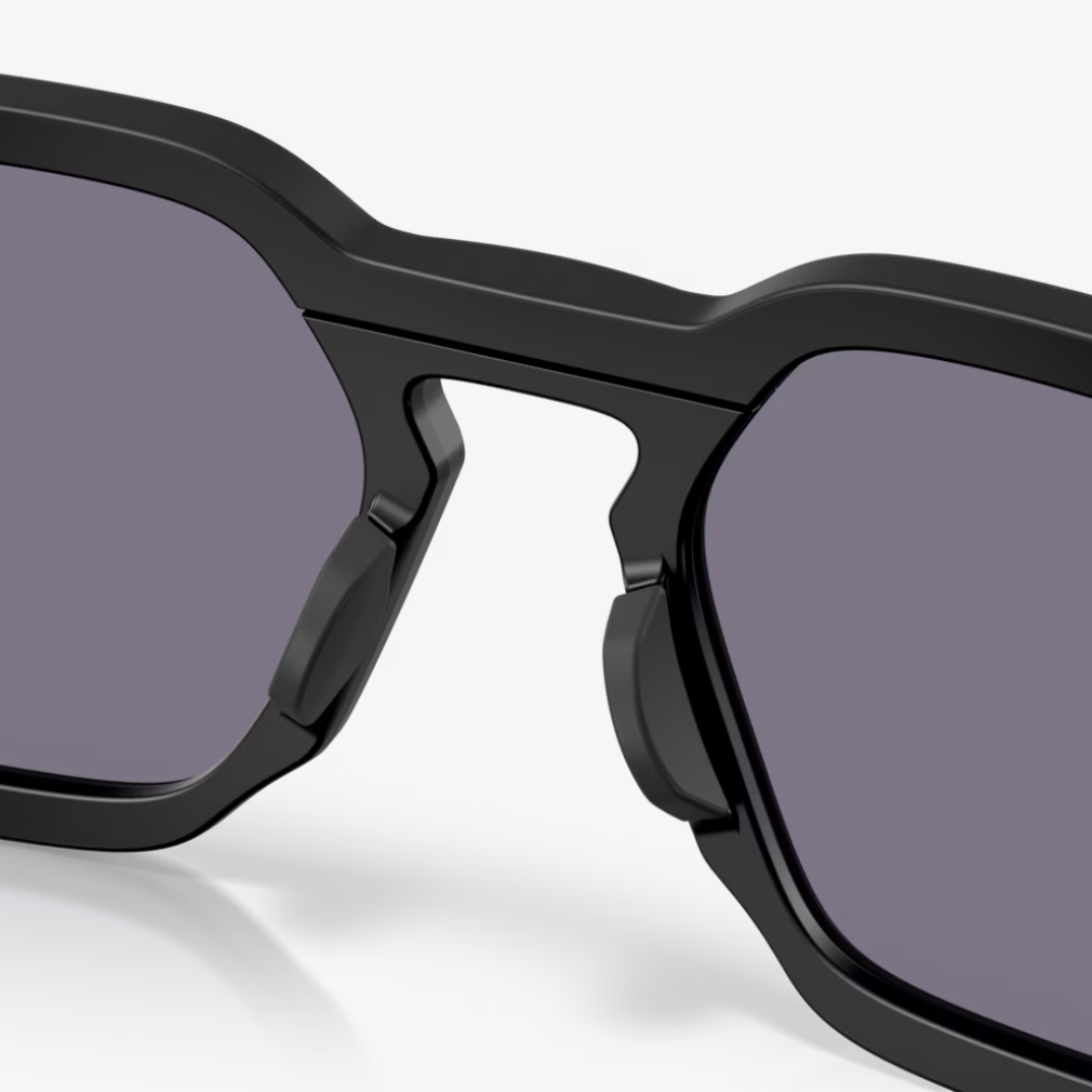 Black sunglasses with dark lenses on a white background
