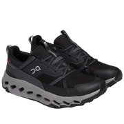 Black athletic shoes with gray sole on a white background