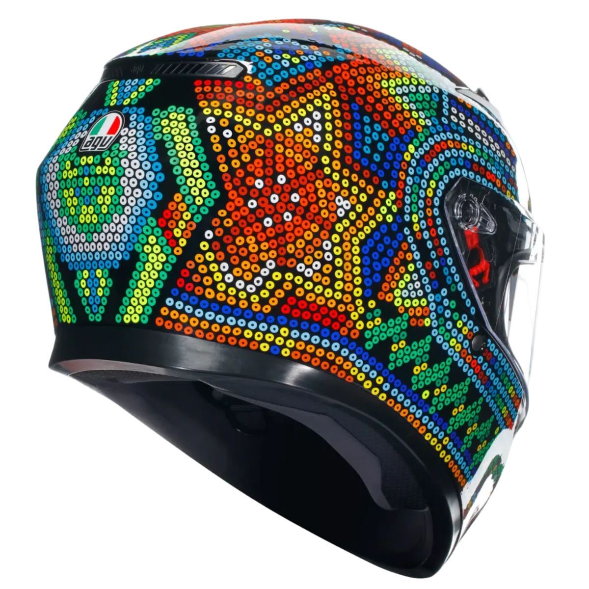 A full-face motorcycle helmet featuring a vibrant, multicolored Aboriginal-style dot art pattern on a glossy black base, shown from a three-quarters angle against a light gray background.