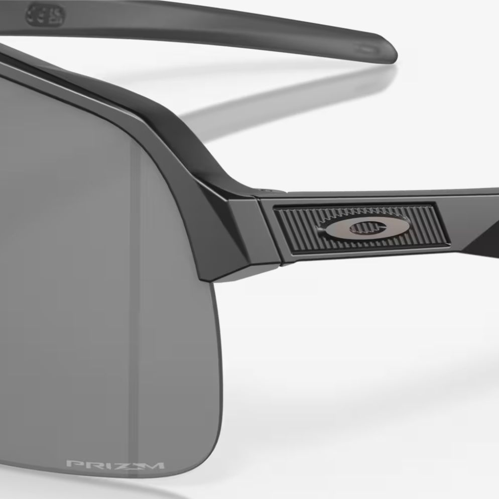 Oakley sunglasses with a black frame and gray lenses on a white background