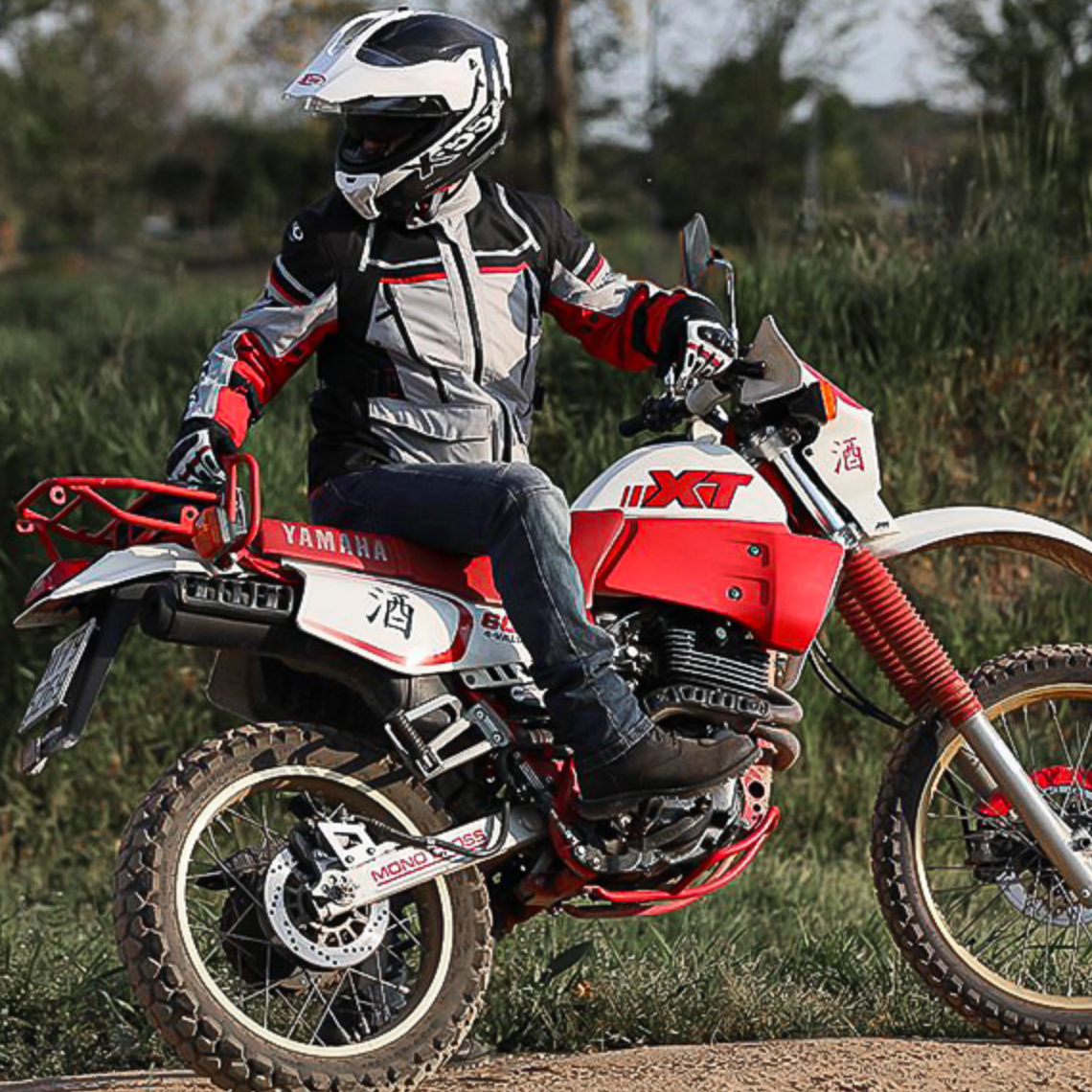 Person riding a dirt bike in an outdoor setting