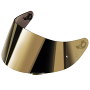 A curved motorcycle helmet visor lens with a metallic gold reflective finish, shown against a light gray background.