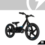 Children's balance bike with black frame and blue accents on a gray background