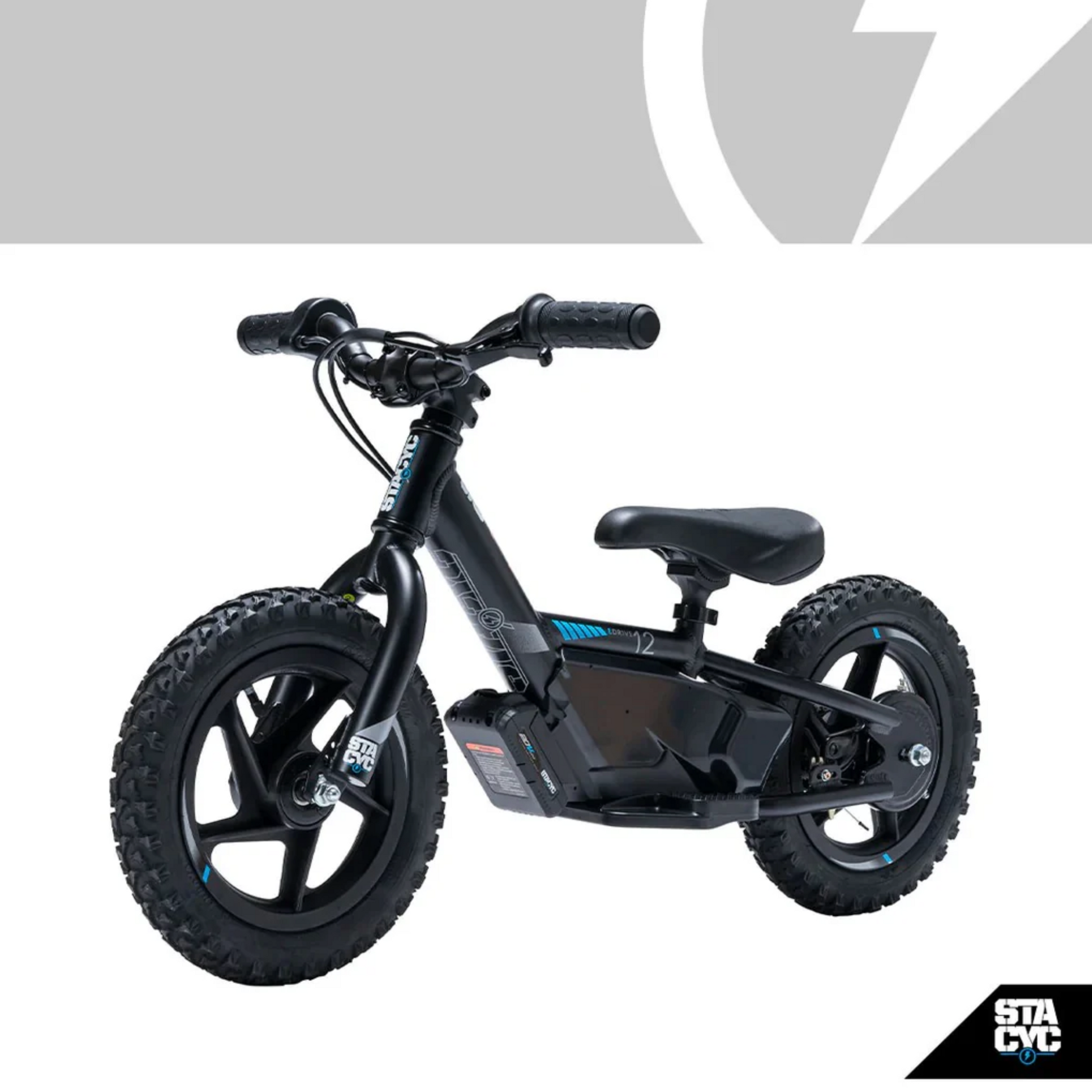 A black kids' balance bike with knobby tires and an integrated battery pack, shown on a white background with a gray logo banner at the top and a STA CVC logo in the bottom right corner.