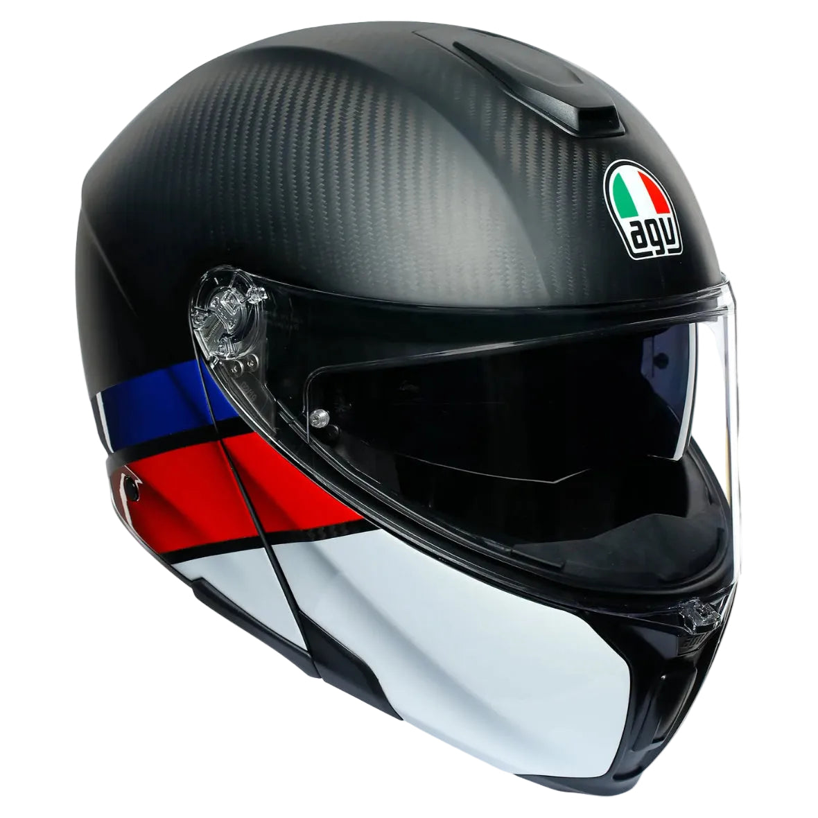 A close-up studio shot of an AGV full-face motorcycle helmet. The helmet features a black and dark gray carbon fiber pattern on the top, a clear visor, a white lower section, and a blue and red stripe detail on the side.